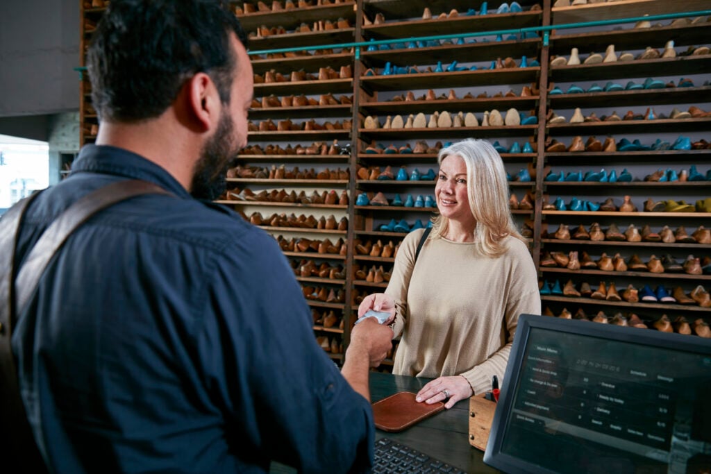 female customer handing credit card to cobbler in 2024 06 19 18 35 24 utc 4 | REFRESH female customer handing credit card to cobbler in 2024 06 19 18 35 24 utc 3